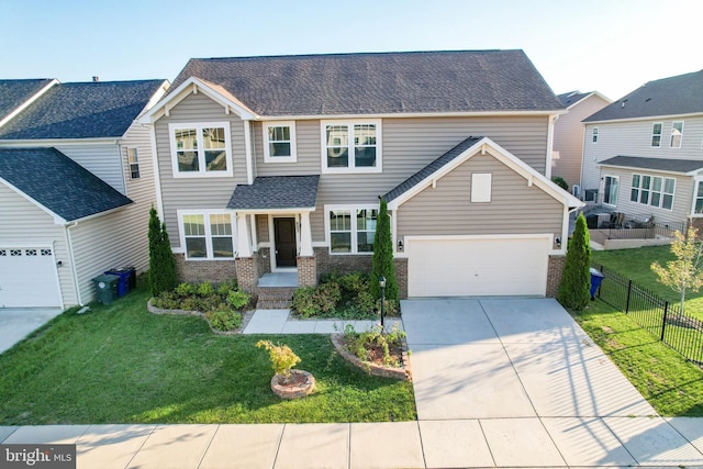 view of front of property featuring a garage and a front yard