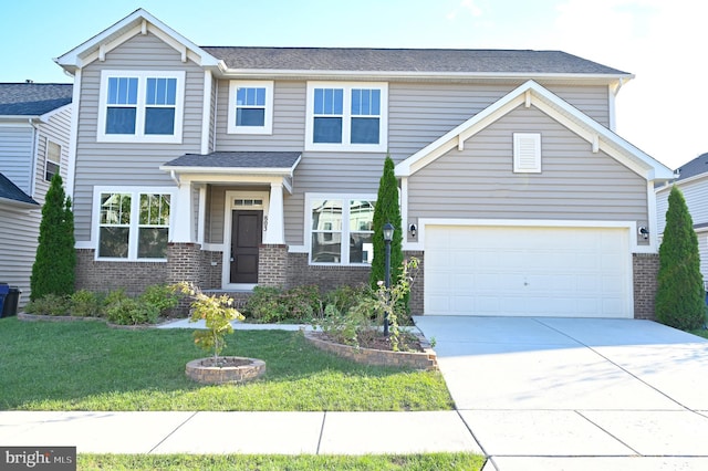 view of front of house featuring a garage and a front yard