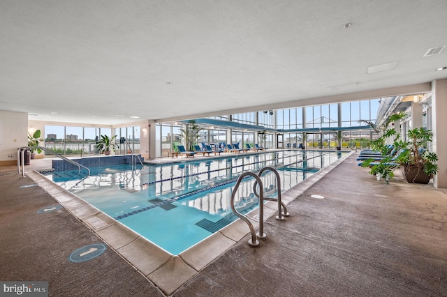 community pool with a patio area