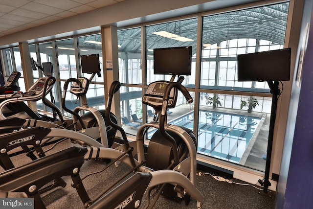 exercise room with a drop ceiling