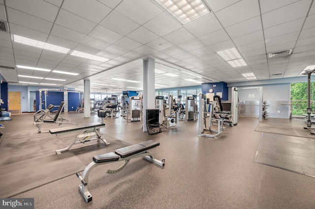 workout area with visible vents and a drop ceiling