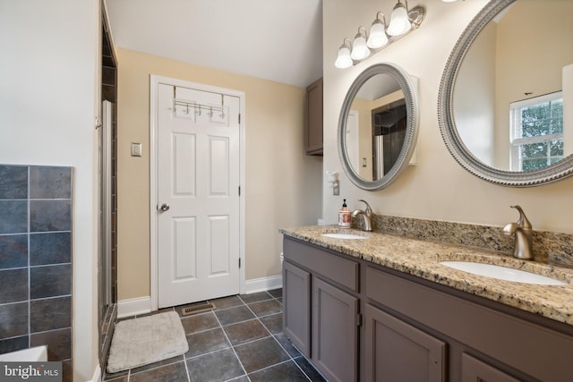 bathroom with tile patterned flooring and vanity