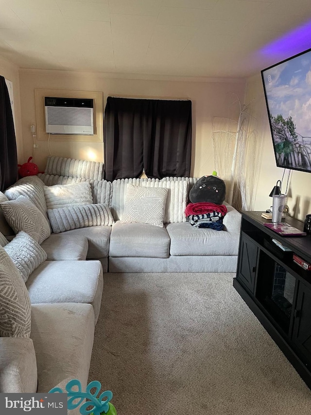 carpeted living area featuring a wall mounted AC