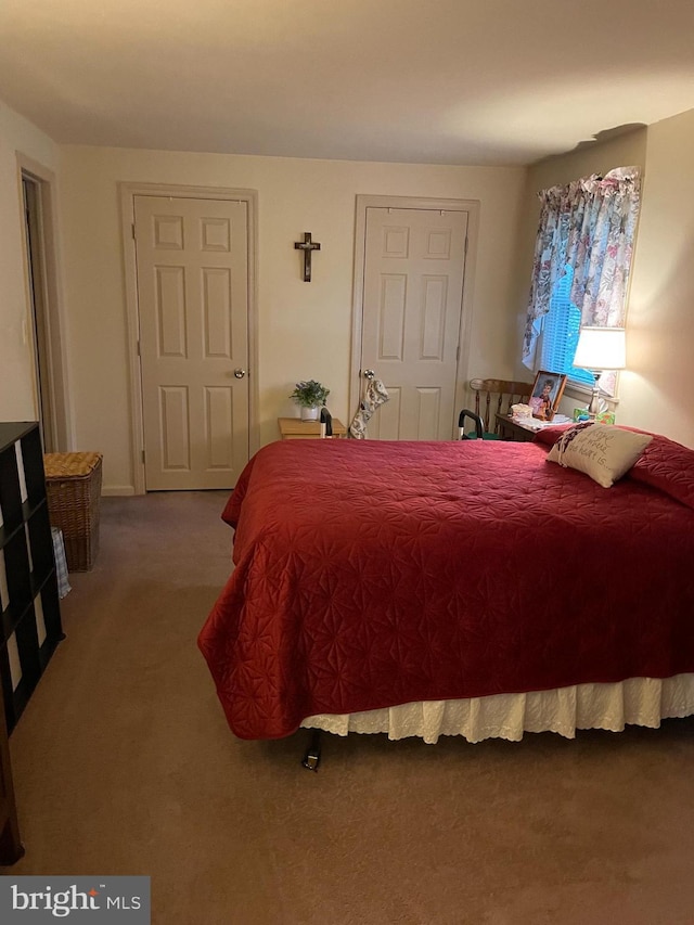 bedroom with dark carpet