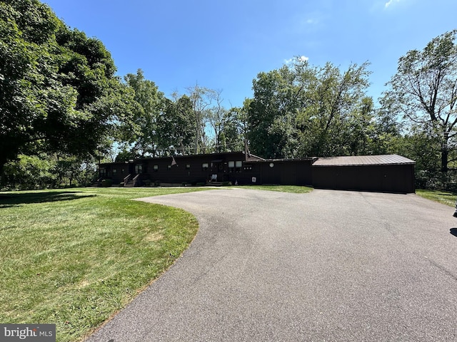 view of road featuring aphalt driveway