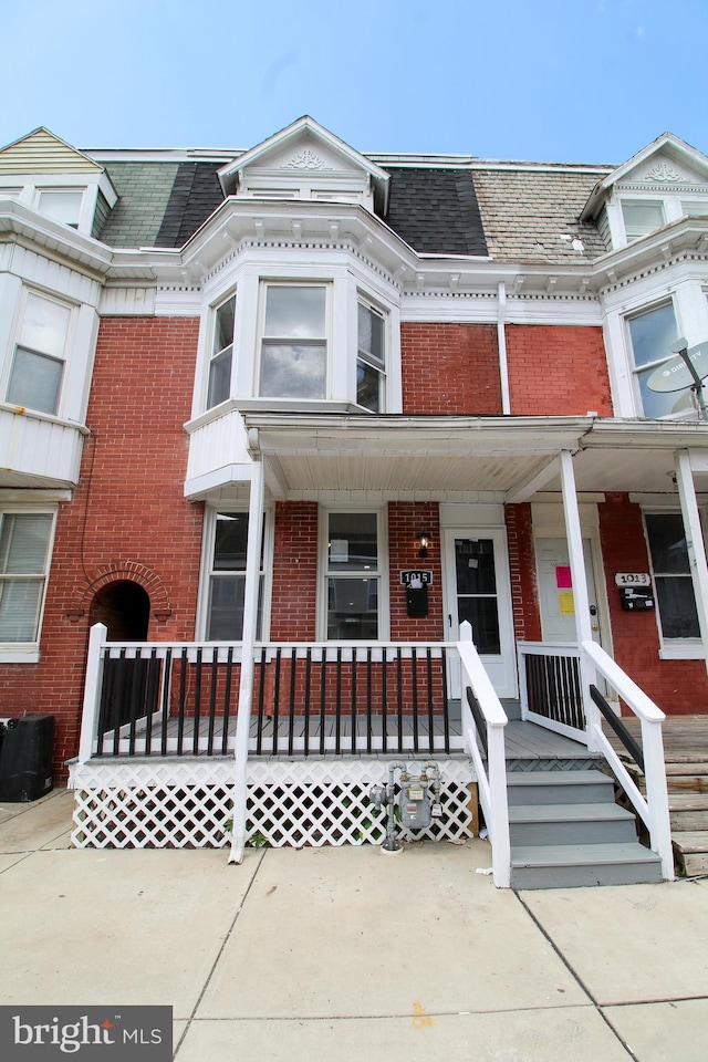 view of property featuring covered porch