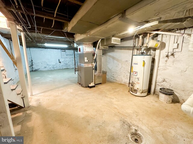 basement with gas water heater and heating unit