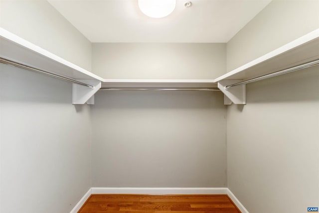 spacious closet with wood finished floors