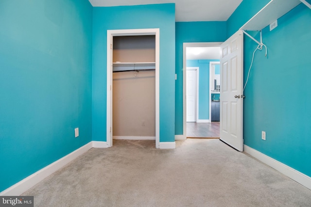 unfurnished bedroom featuring light colored carpet