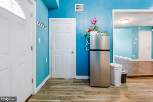 entrance foyer with light hardwood / wood-style floors