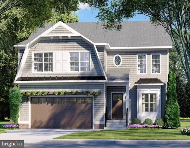 view of front of house featuring a front yard and a garage