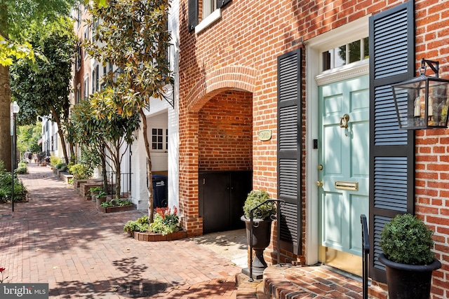 entrance to property with brick siding