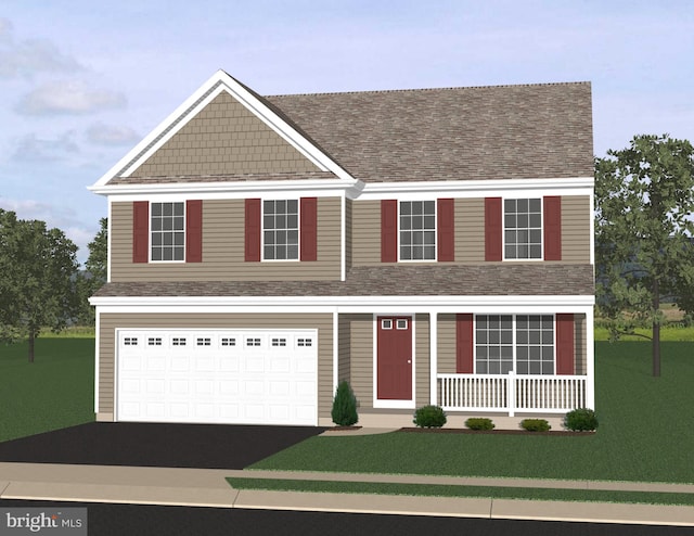 view of front facade with a front yard and a garage