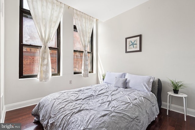 bedroom featuring dark wood-type flooring