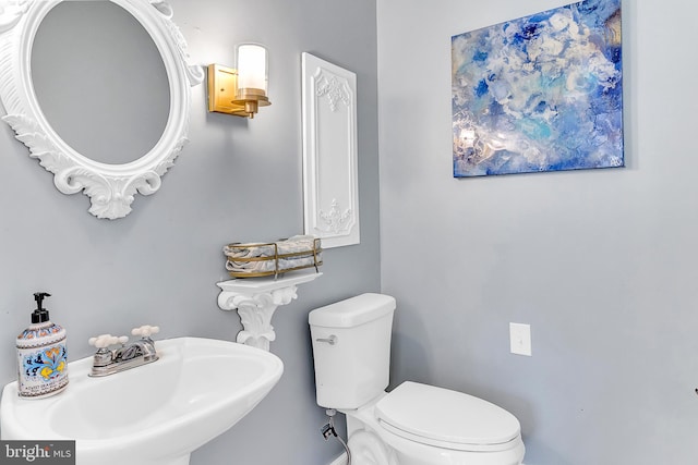 bathroom with toilet and sink