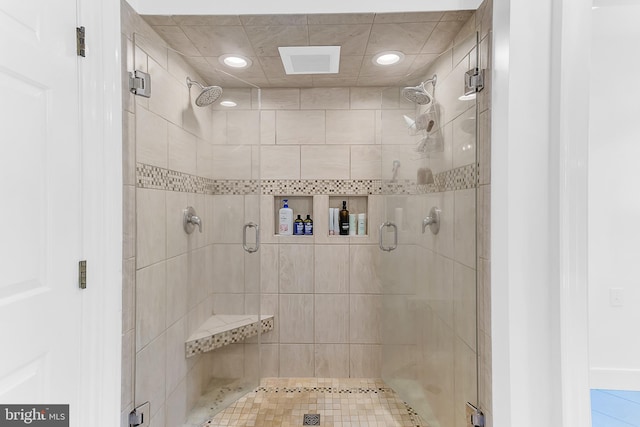 bathroom featuring a shower with door