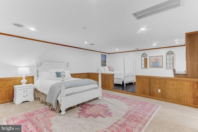 bedroom featuring wooden walls and crown molding