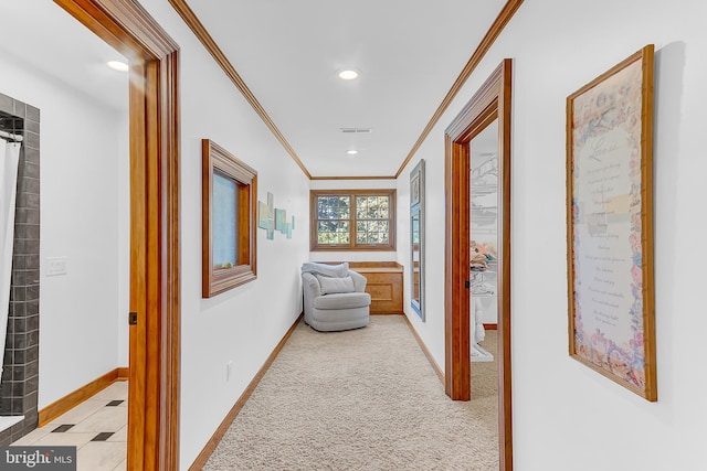 hallway featuring crown molding and light carpet