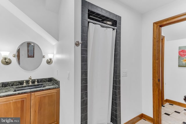 bathroom with vanity, curtained shower, and tile patterned floors