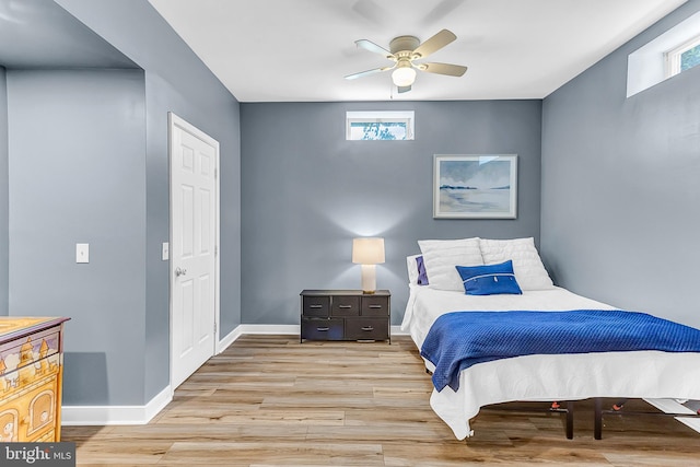 bedroom featuring light hardwood / wood-style floors and ceiling fan