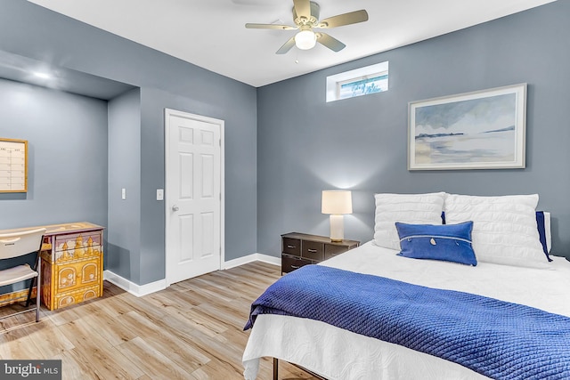 bedroom featuring light wood-type flooring and ceiling fan