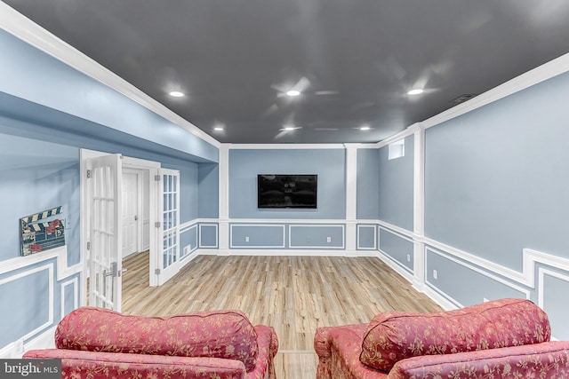 living room with ornamental molding and hardwood / wood-style flooring