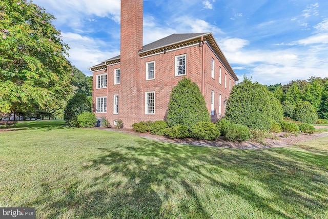 view of property exterior with a yard