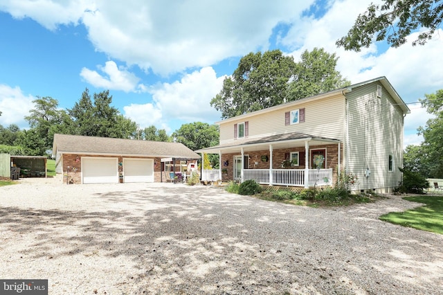 view of front of house with a garage and a porch