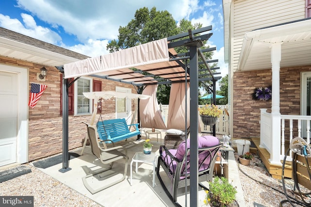 view of patio / terrace with an outdoor hangout area and a pergola