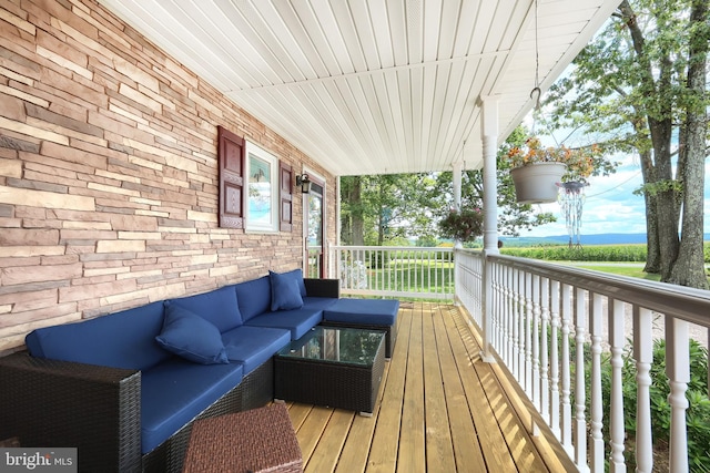 wooden deck with outdoor lounge area