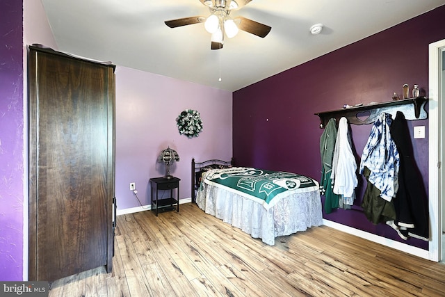 bedroom featuring ceiling fan and light hardwood / wood-style flooring