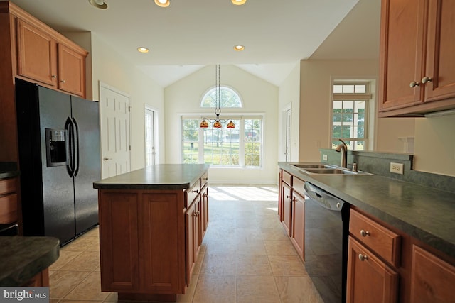 kitchen featuring dishwasher, sink, lofted ceiling, a healthy amount of sunlight, and black fridge