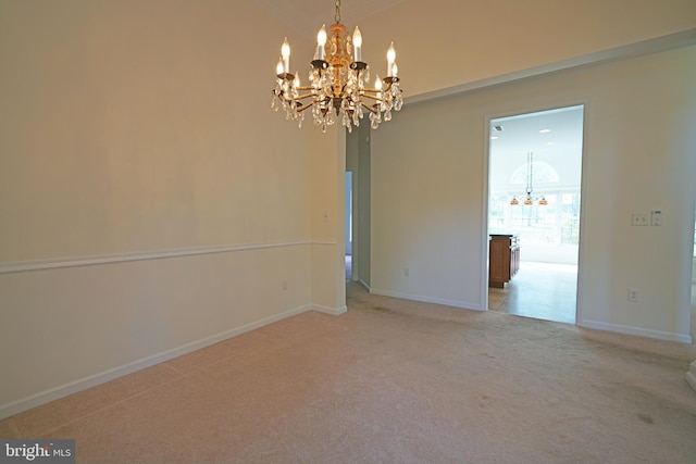 interior space featuring carpet and a chandelier