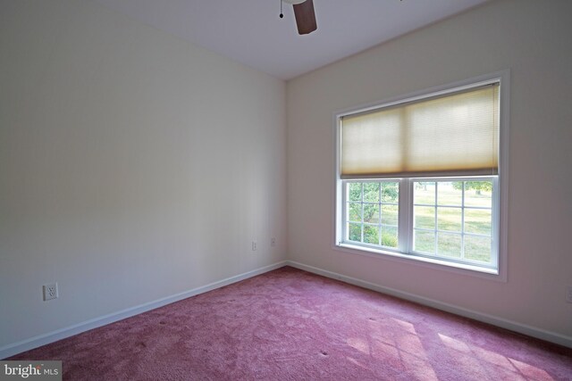 carpeted empty room featuring ceiling fan