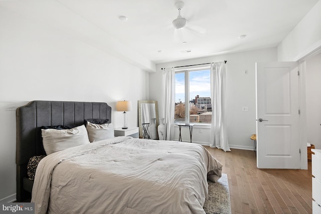 bedroom featuring light hardwood / wood-style floors and ceiling fan