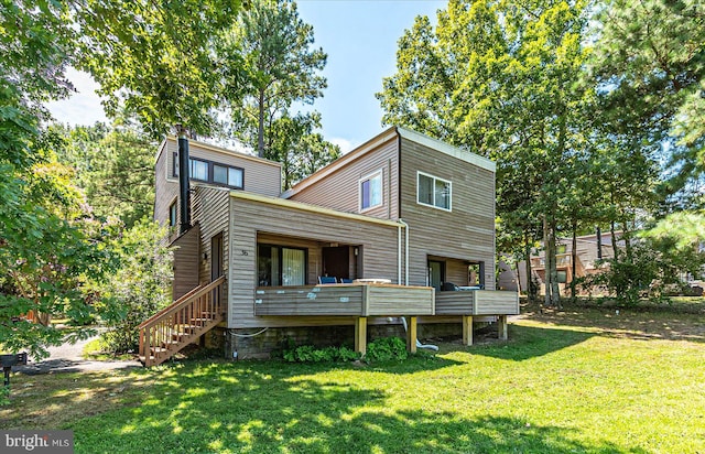 rear view of property with a yard