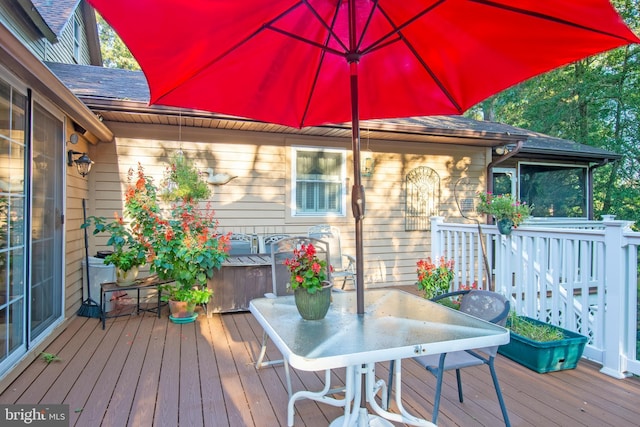 wooden deck with outdoor dining area