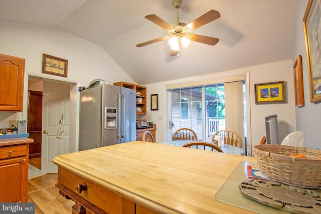 kitchen with light wood-type flooring, high quality fridge, ceiling fan, and lofted ceiling