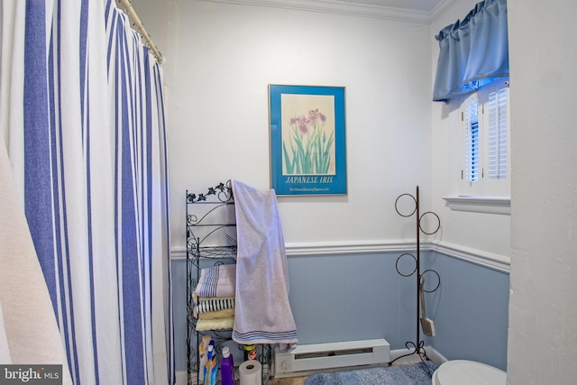 full bathroom with a wainscoted wall, ornamental molding, a baseboard radiator, and toilet