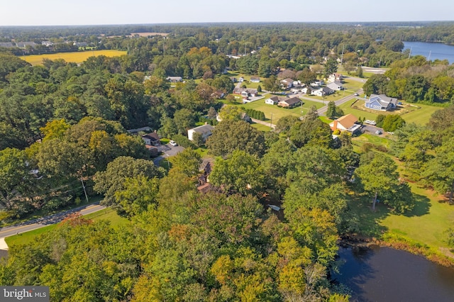 aerial view with a water view, a wooded view, and a residential view