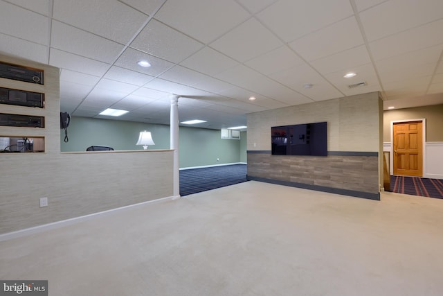 basement with carpet and a drop ceiling