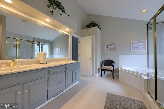 bathroom with lofted ceiling, vanity, independent shower and bath, and tile patterned floors