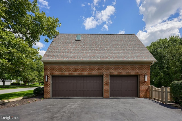 view of side of property with a garage