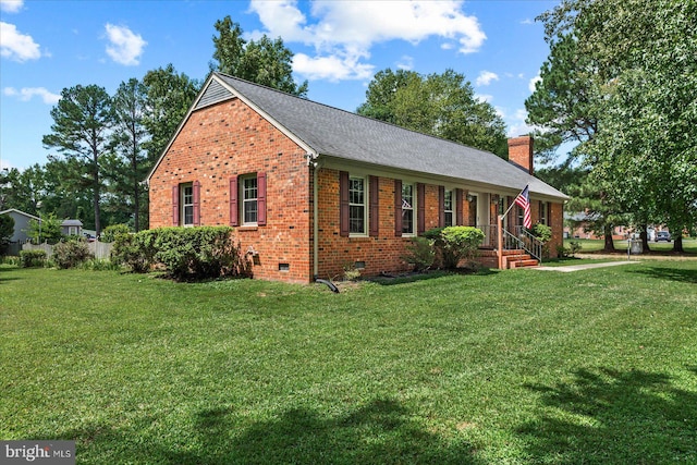 view of side of home with a lawn