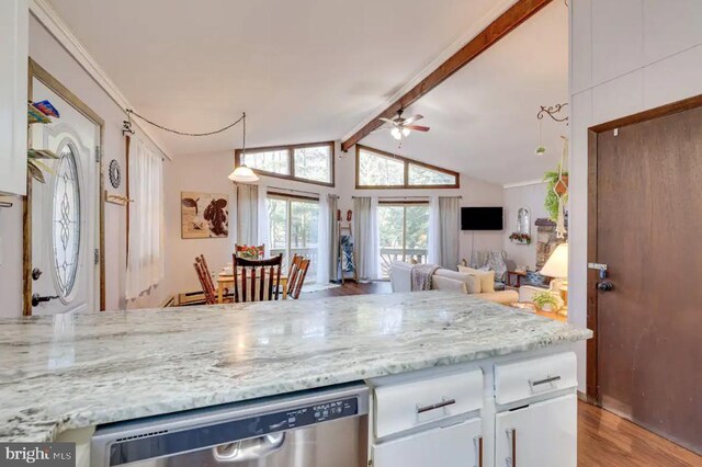 kitchen with light hardwood / wood-style flooring, stainless steel dishwasher, lofted ceiling with beams, light stone countertops, and ceiling fan