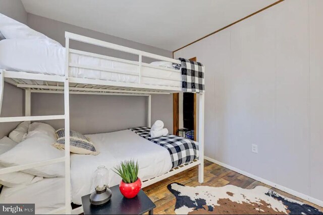 bedroom featuring wood-type flooring