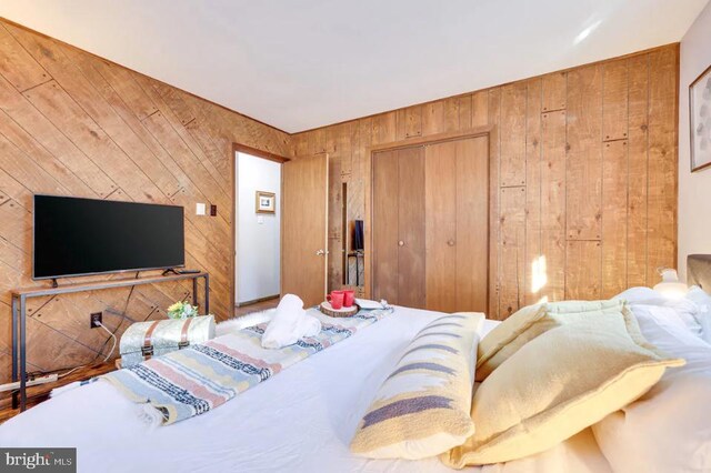 bedroom with wooden walls