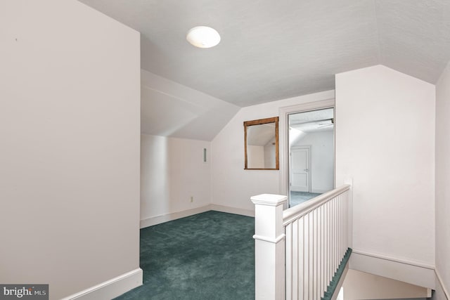 bonus room featuring lofted ceiling, carpet, and baseboards