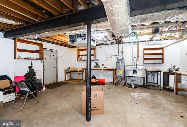 unfinished basement featuring electric water heater, a sink, and a workshop area