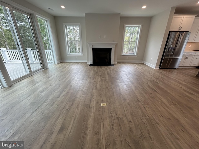 unfurnished living room featuring light wood-type flooring